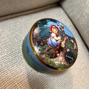 M.I. Hummel. “Apple Tree Girl” from the MI Hummel music box collection.